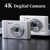 Deux caméras numériques 4K blanches avec objectifs argentés pour Caméra de voyage 4K zoom optique